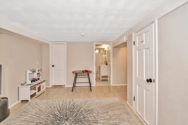 a room that has a bed and a chair in it