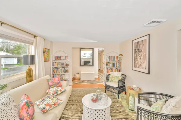 a living room with furniture and a table