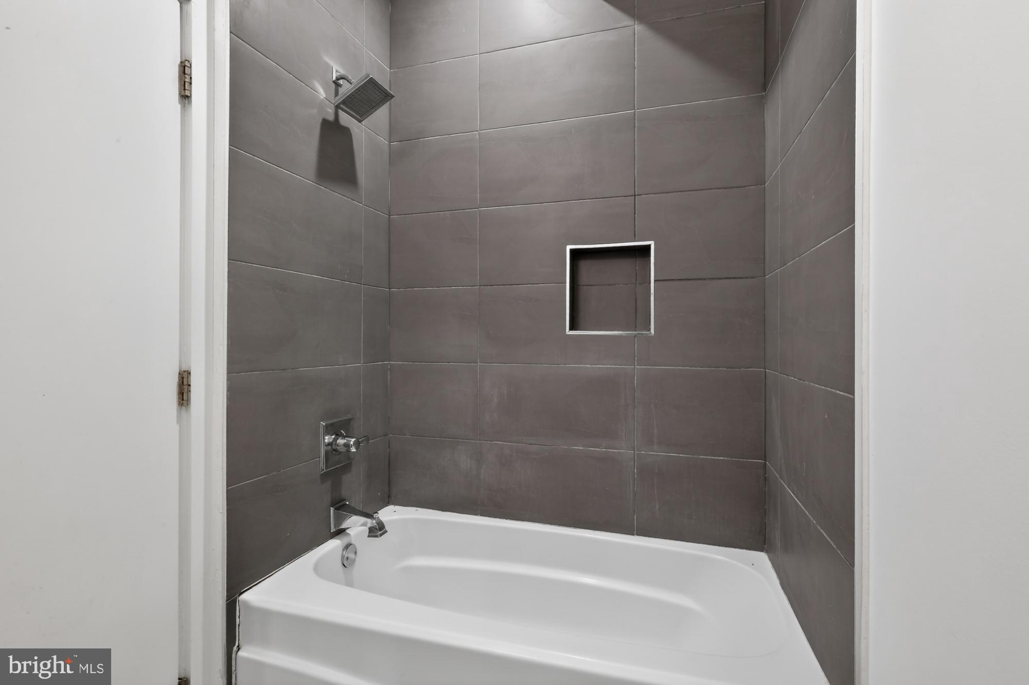1445 South 32nd Street, Unit 1 Philadelphia, PA 19146 - Photo 17 of 23 a bathroom with a bathtub