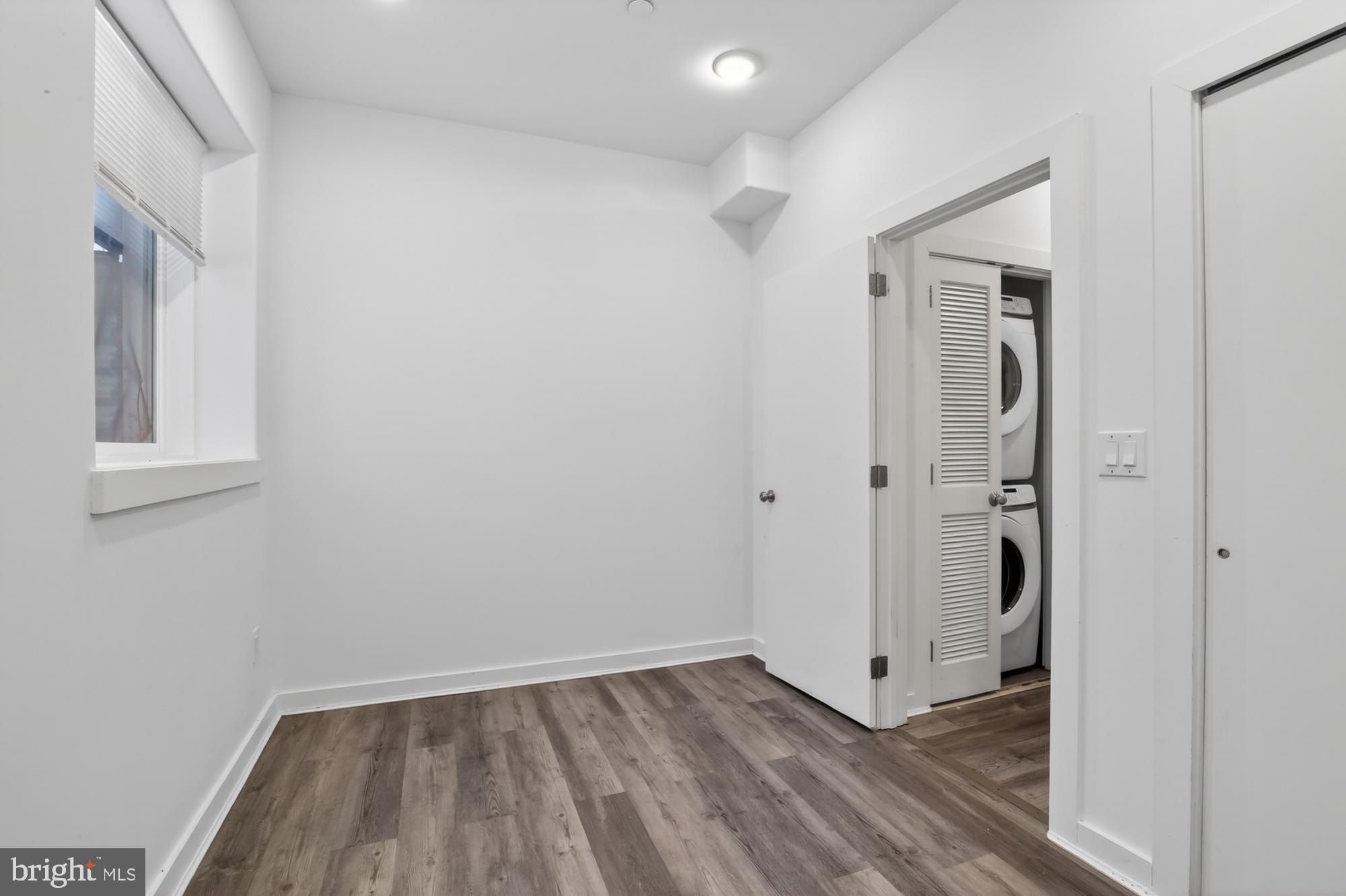 1445 South 32nd Street, Unit 1 Philadelphia, PA 19146 - Photo 21 of 23 a view of a hallway with wooden floor and closet