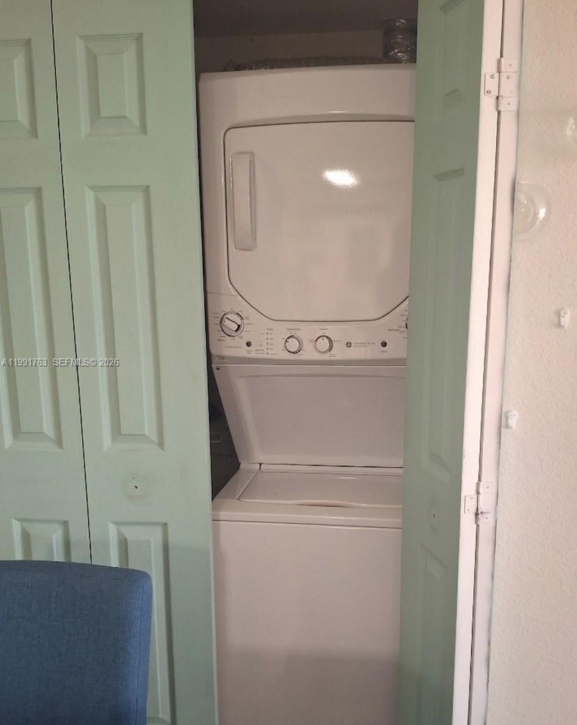 816 Northwest 11th Street, Unit 806 Miami, FL 33136 - Photo 12 of 12 a utility room with dryer and washer