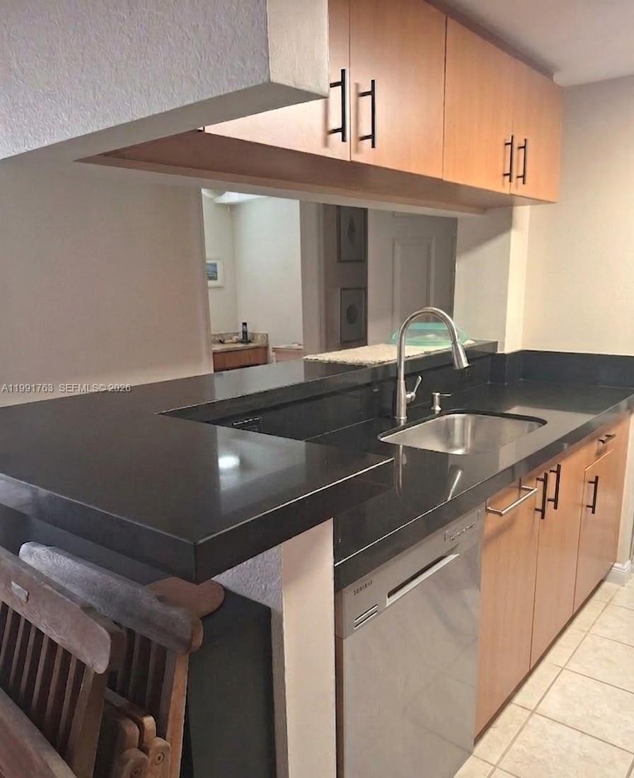 816 Northwest 11th Street, Unit 806 Miami, FL 33136 - Photo 2 of 12 a close view of sink and tap