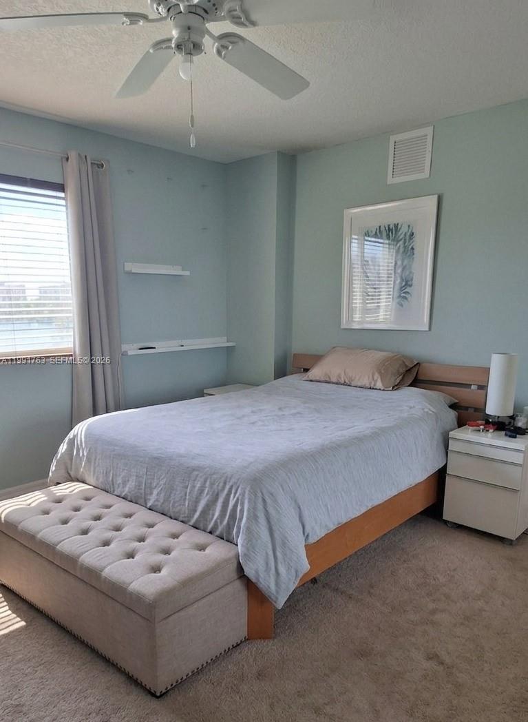 816 Northwest 11th Street, Unit 806 Miami, FL 33136 - Photo 4 of 12 a bedroom with bed and window