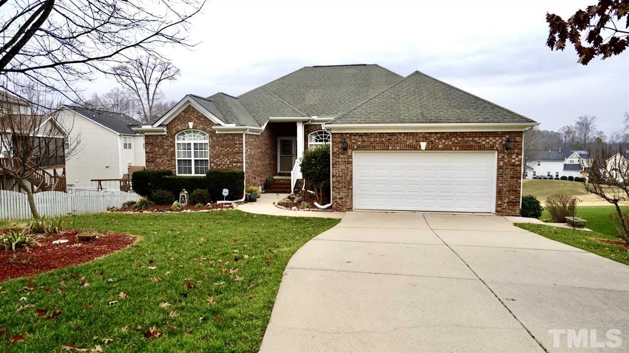116 Okamato Street Raleigh, NC 27603 - Photo 1 of 19 a front view of a house with a garden