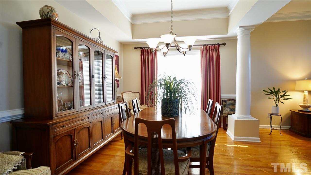116 Okamato Street Raleigh, NC 27603 - Photo 5 of 19 a view of a dining room with furniture window and wooden floor