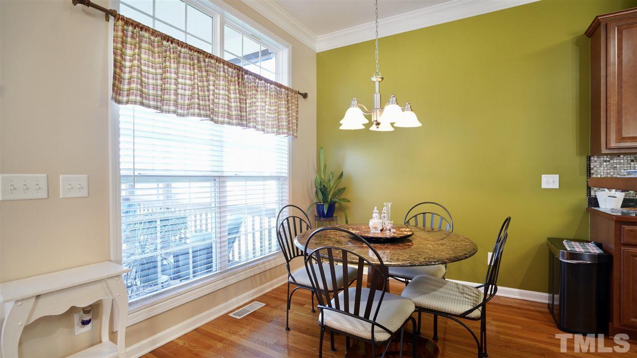 116 Okamato Street Raleigh, NC 27603 - Photo 8 of 19 a view of a dining room with furniture and chandelier