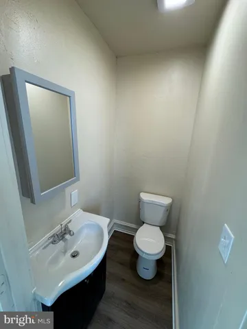 a bathroom with a toilet and a sink