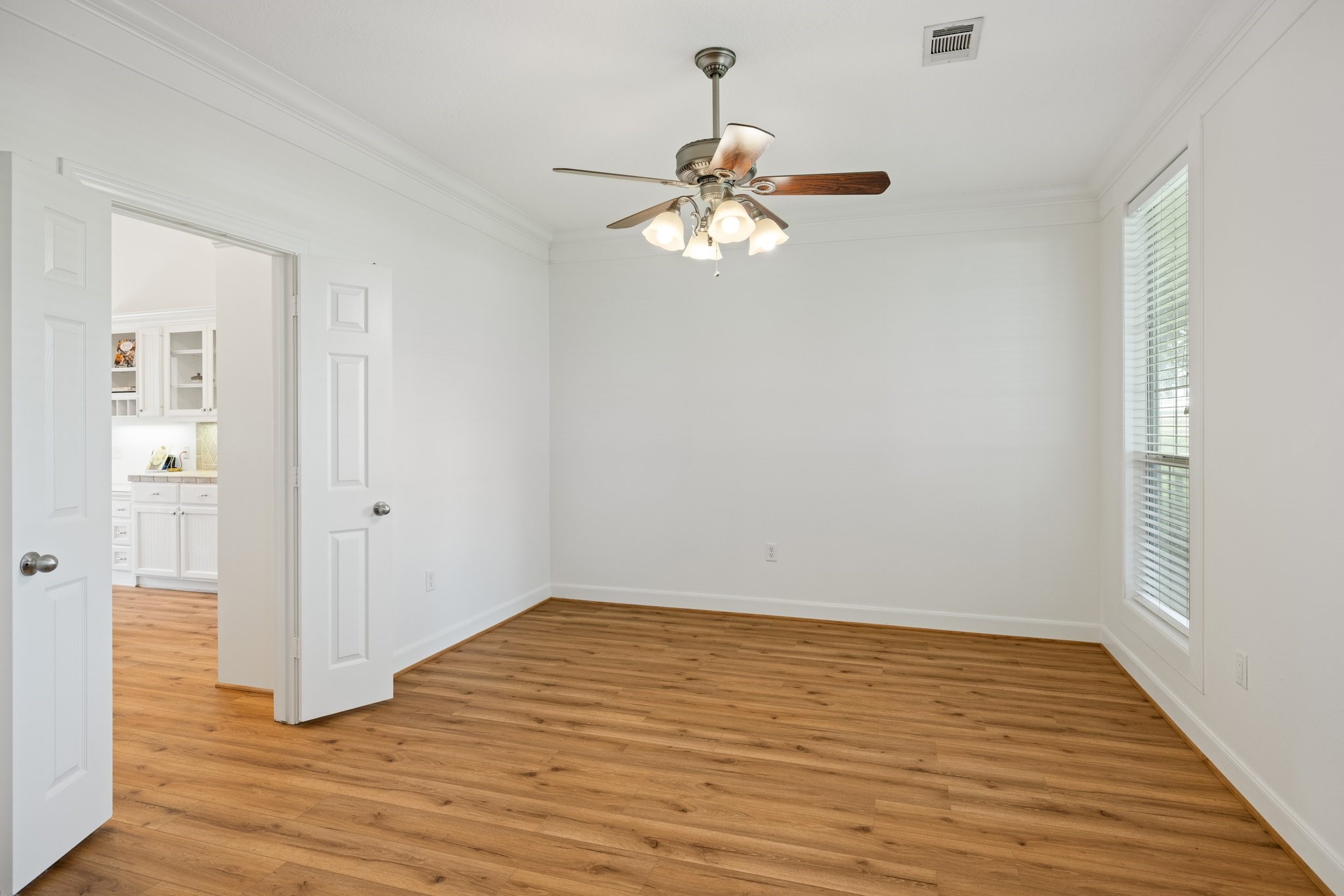 34310 High Point Drive Magnolia, TX 77355 - Photo 7 of 48 Elegant dining room next to the kitchen—ideal for hosting dinner parties.