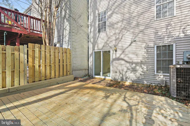 a view of a brick house with many windows