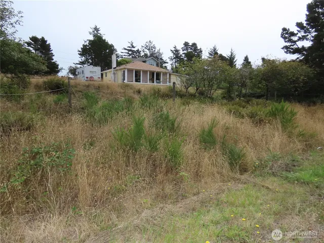 a view of a lake in front of a house