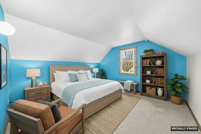 a bedroom with a bed and a couch