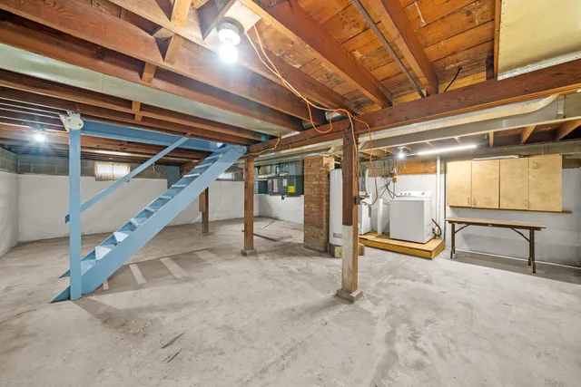 a view of an empty room with stairs