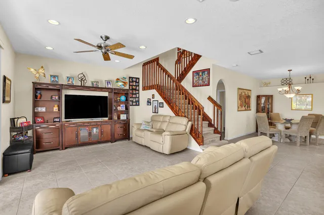 a bedroom with a large bed and a large window