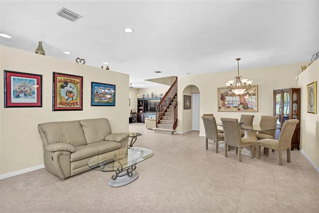a bathroom with a sink shower and a mirror