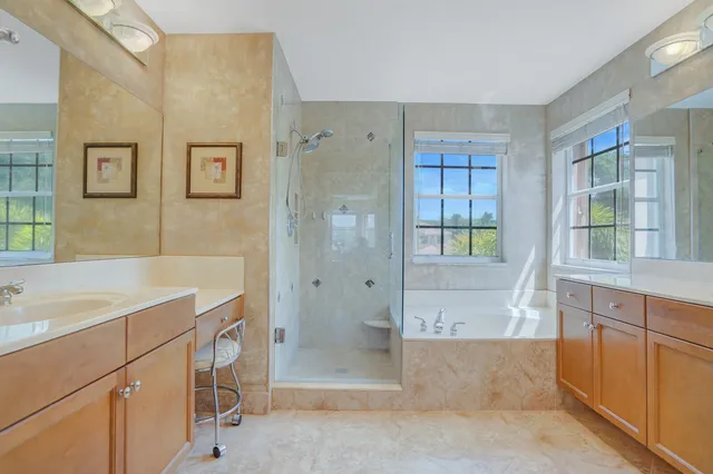 a view of a lake with houses in the back