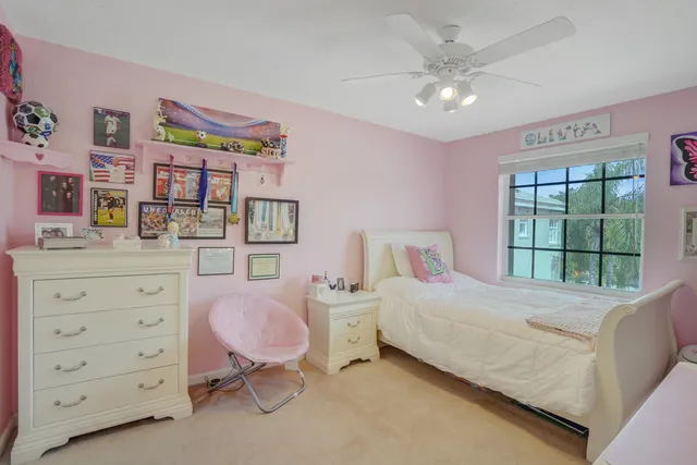an aerial view of a house with garden space and a street view
