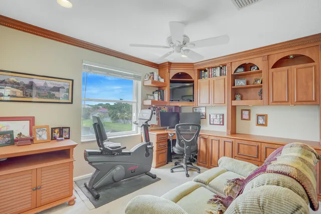 an aerial view of residential houses with outdoor space and lake view
