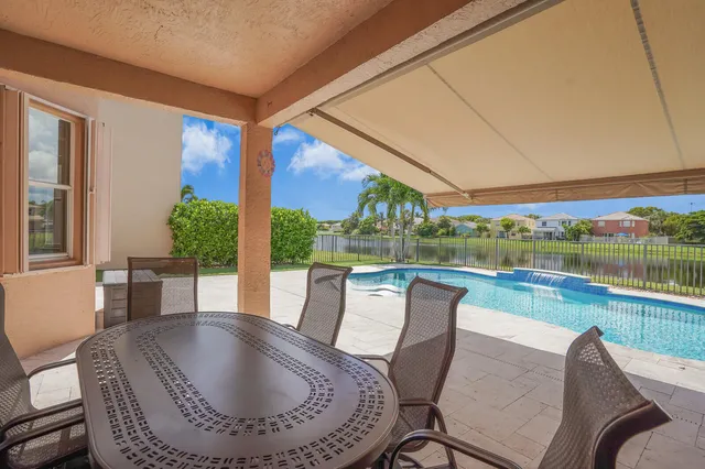 an aerial view of a house with garden space and street view