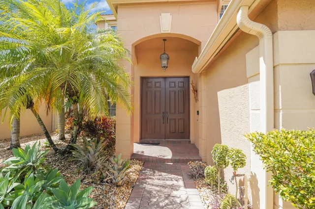 a kitchen with stainless steel appliances granite countertop a sink and a stove