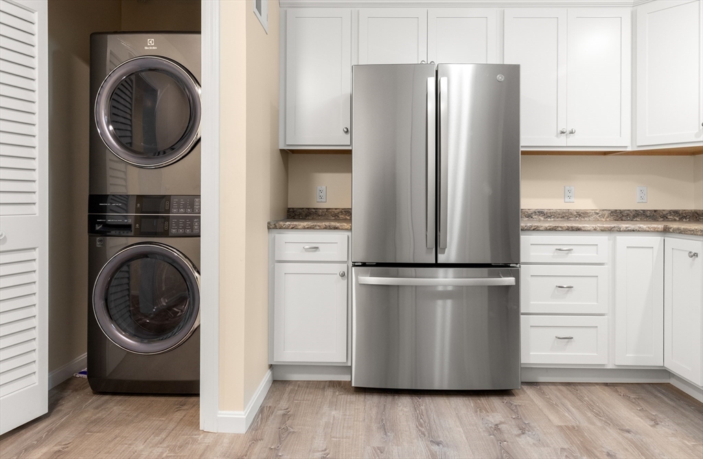 86 Ferry Road Salisbury, MA 01952 - Photo 11 of 28 a kitchen with a refrigerator and cabinets
