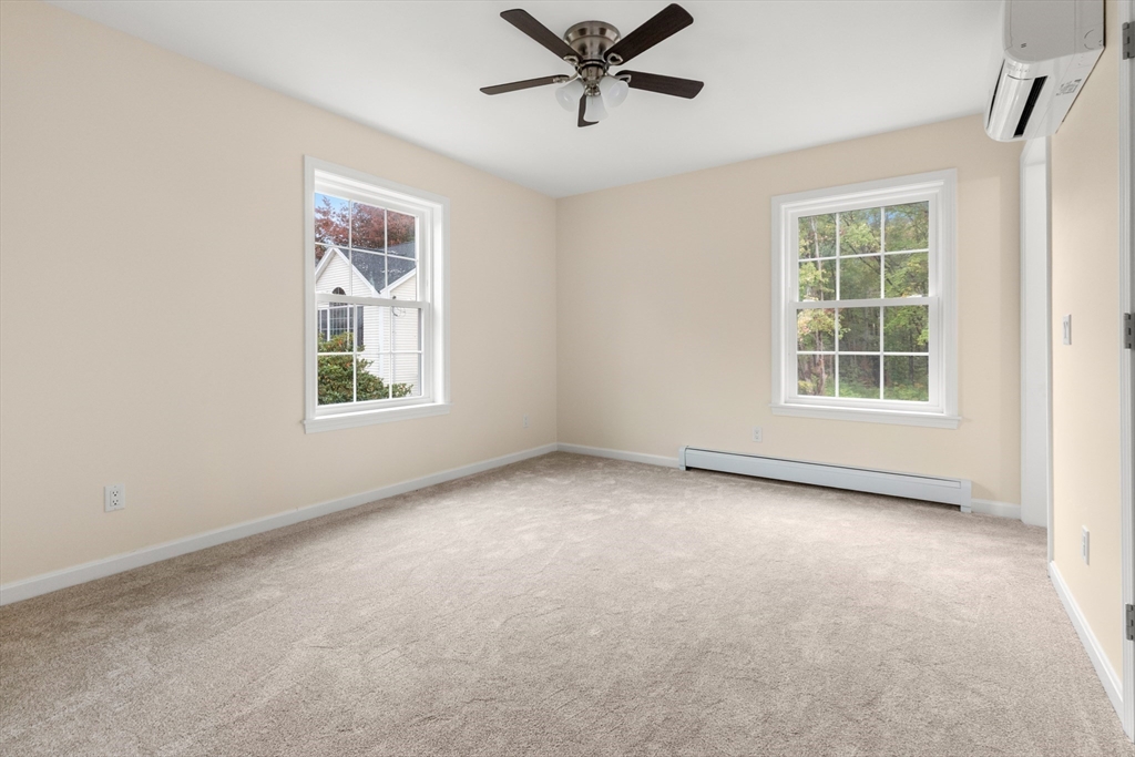 86 Ferry Road Salisbury, MA 01952 - Photo 21 of 28 an empty room with windows and ceiling fan