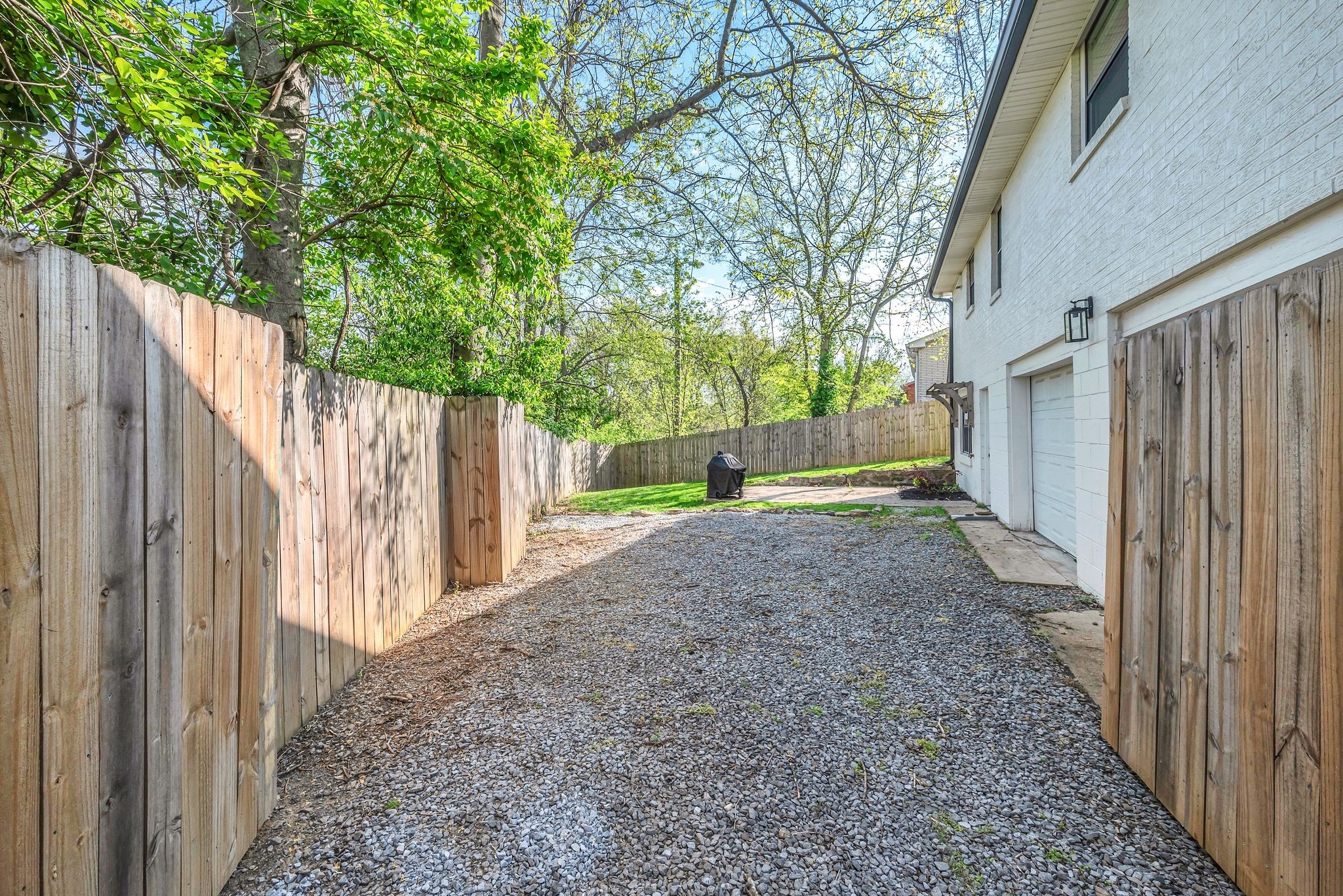3217 Spears Road Nashville, TN 37207 - Photo 17 of 21 a view of a backyard with large trees and wooden fence