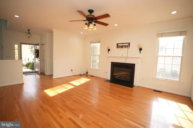 a view of livingroom with hardwood floor and a ceiling fan