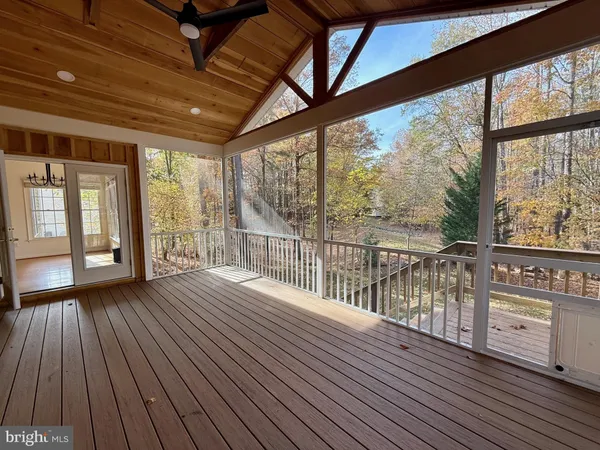 a view of a balcony with wooden floor