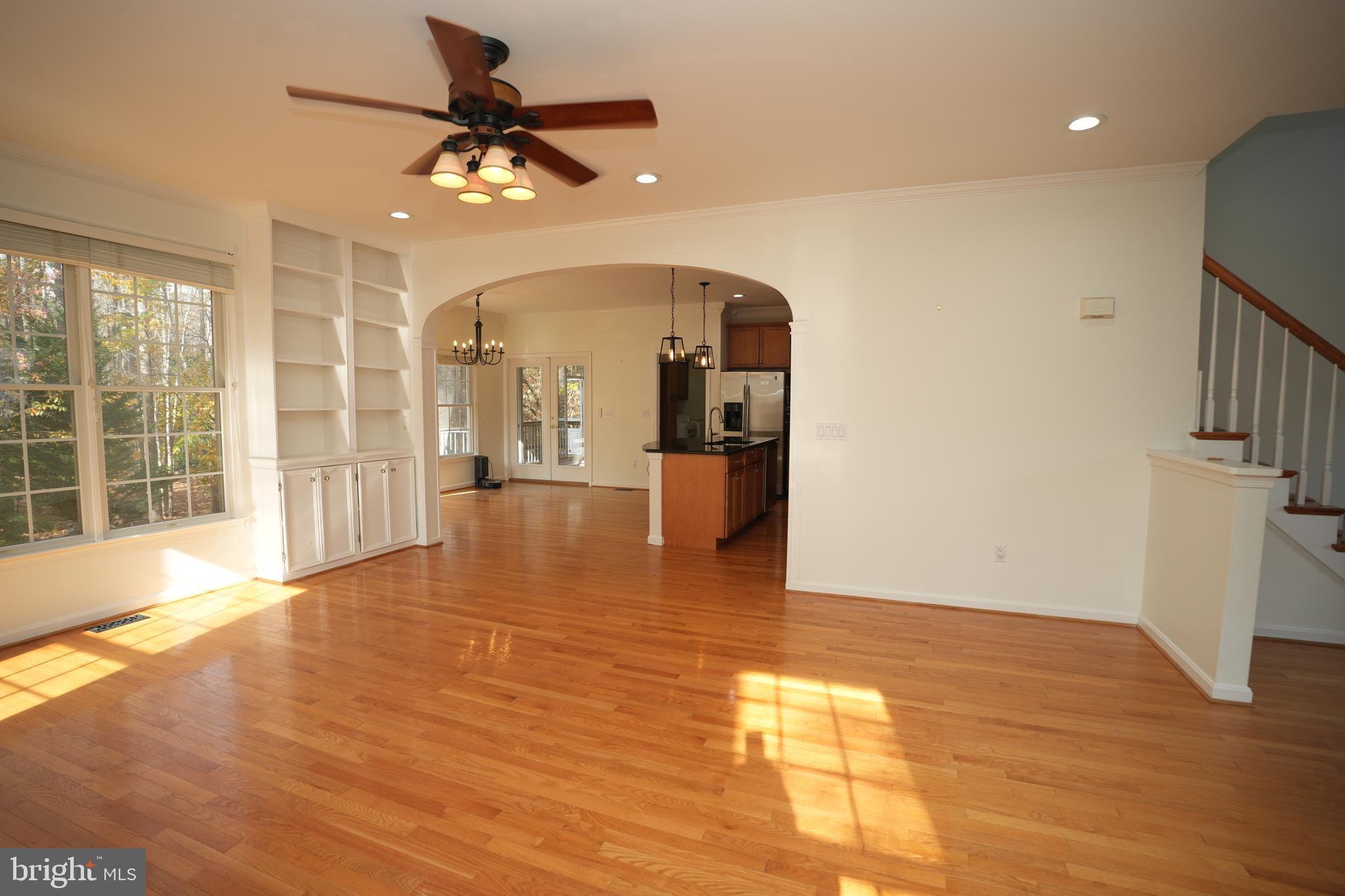 23293 Misty Pond Lane California, MD 20619 - Photo 5 of 35 a view of an empty room with wooden floor and a window