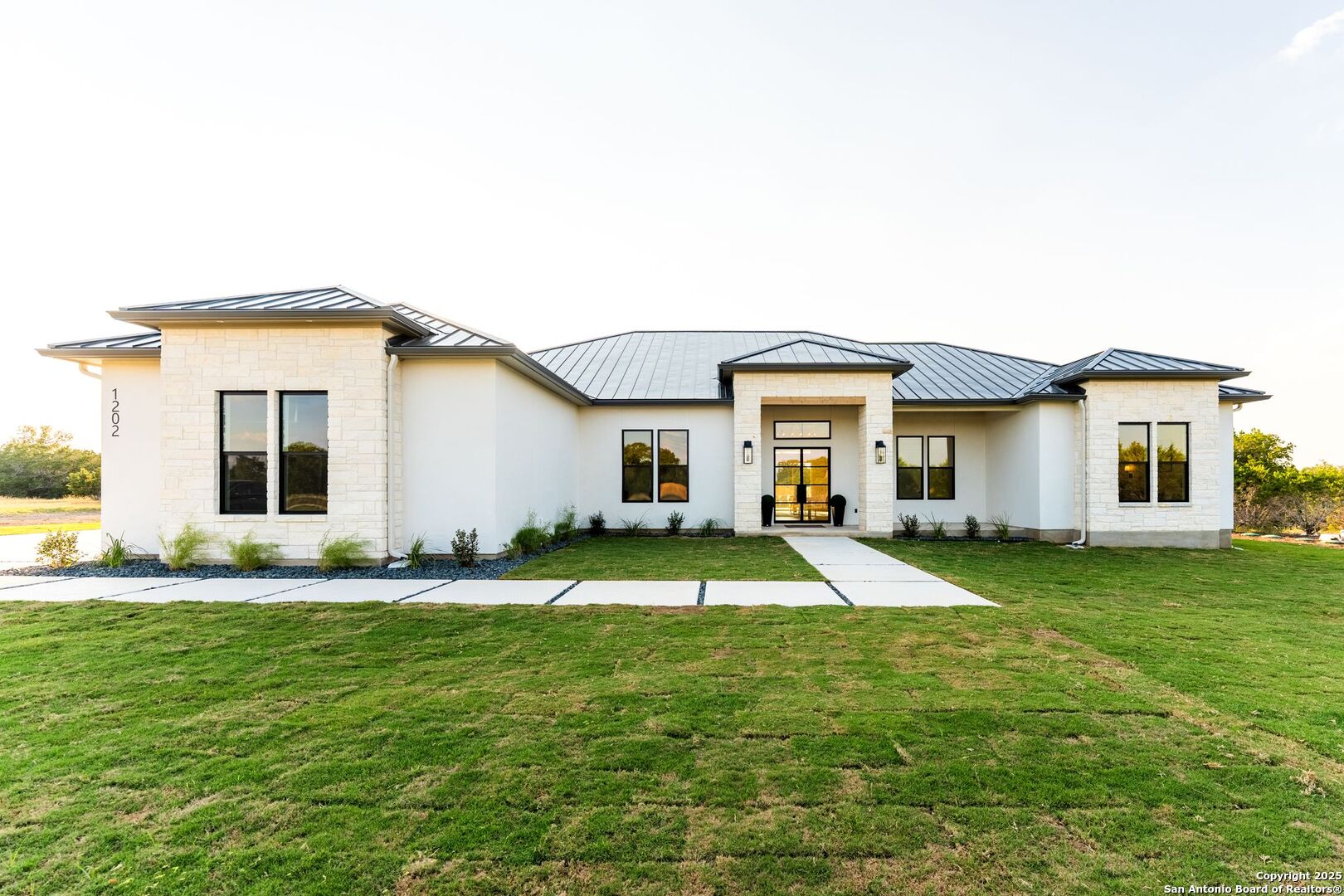 1202 Cielo Rio Drive Pipe Creek, TX 78063 - Photo 1 of 54 a view of a house with a big yard and large tree