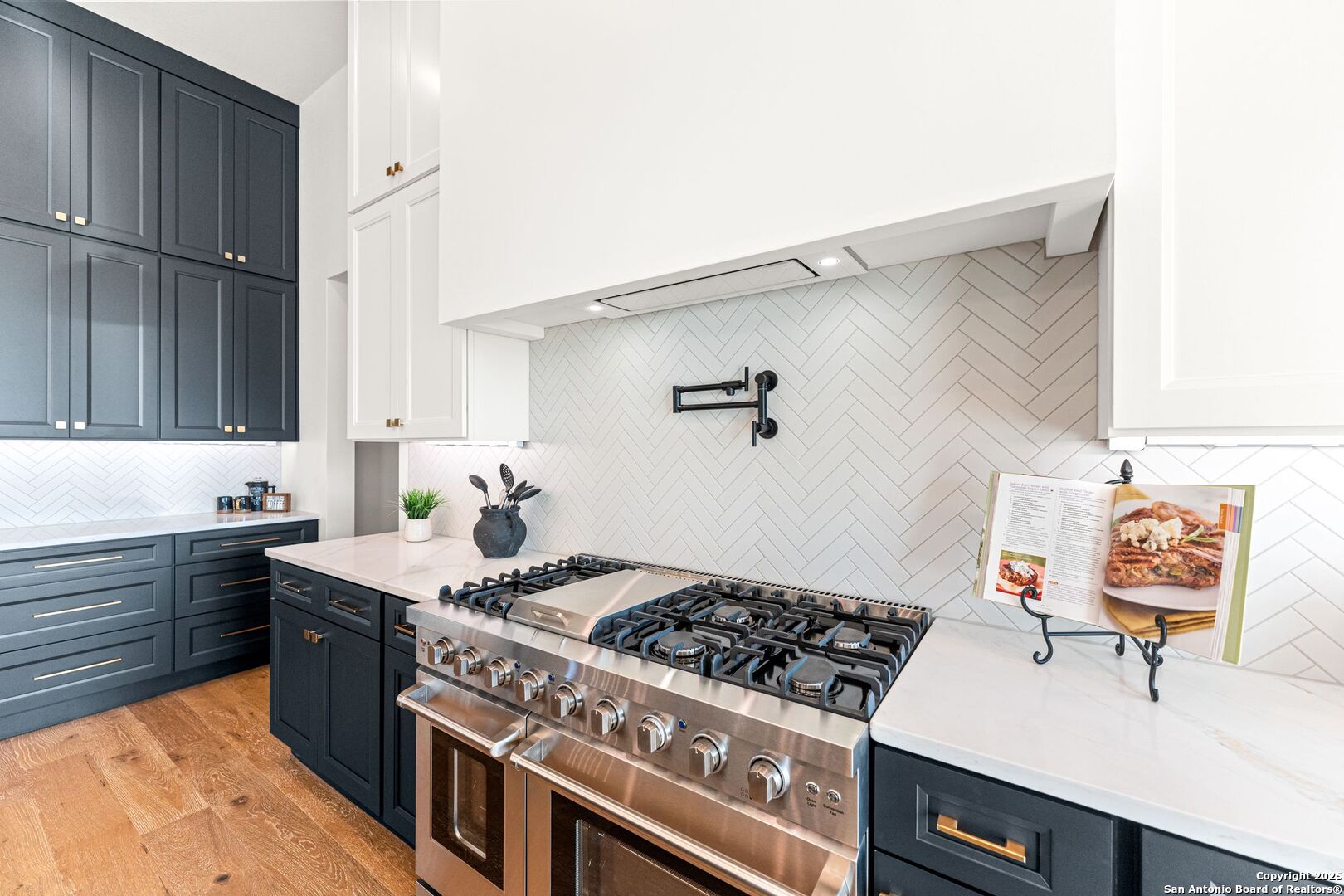1202 Cielo Rio Drive Pipe Creek, TX 78063 - Photo 13 of 54 a kitchen with a stove and a sink