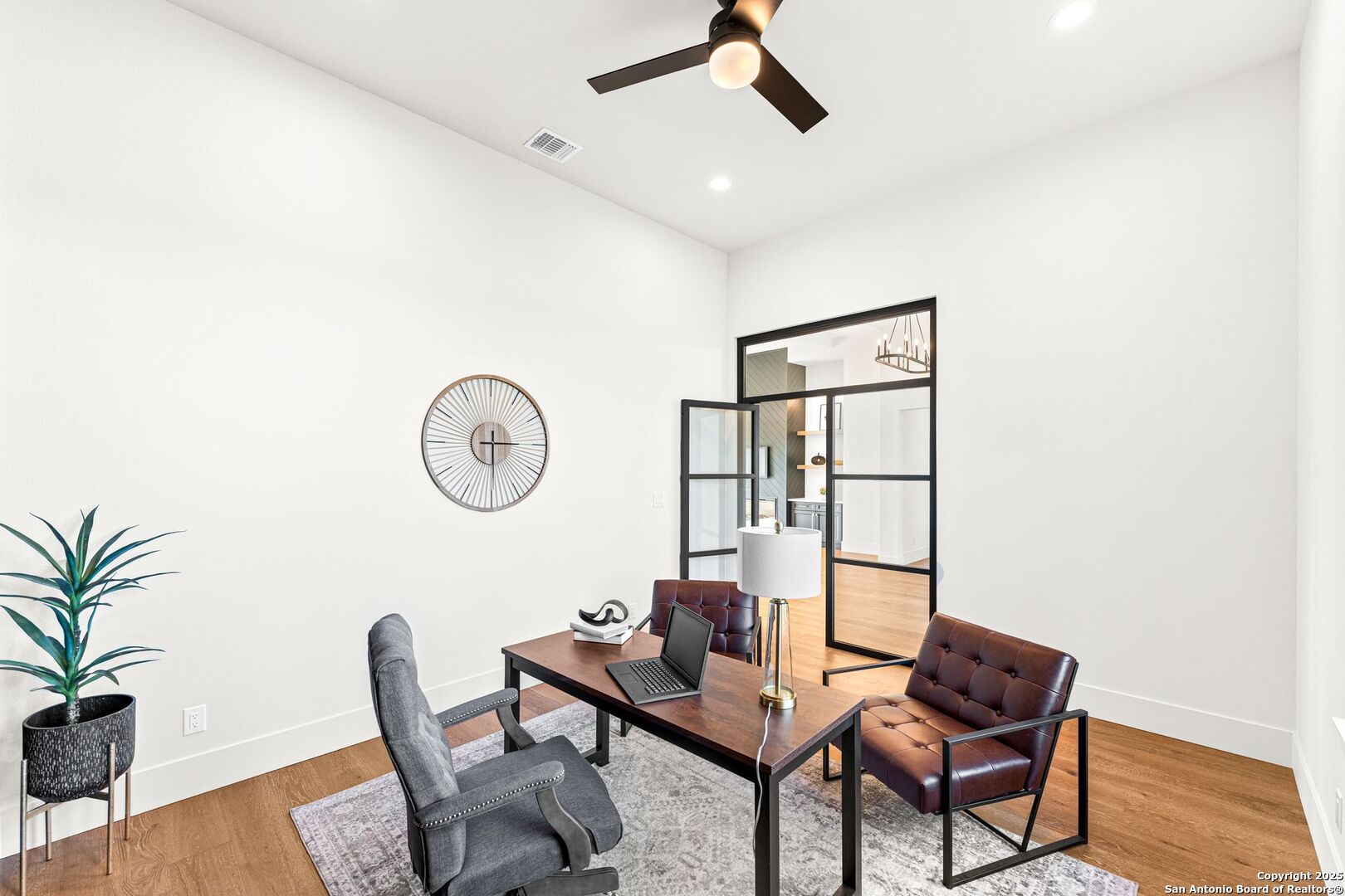 1202 Cielo Rio Drive Pipe Creek, TX 78063 - Photo 18 of 54 a view of a livingroom with furniture and wooden floor