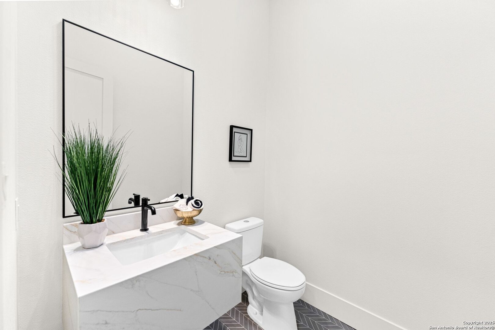 1202 Cielo Rio Drive Pipe Creek, TX 78063 - Photo 20 of 54 a bathroom with a sink mirror vanity and toilet