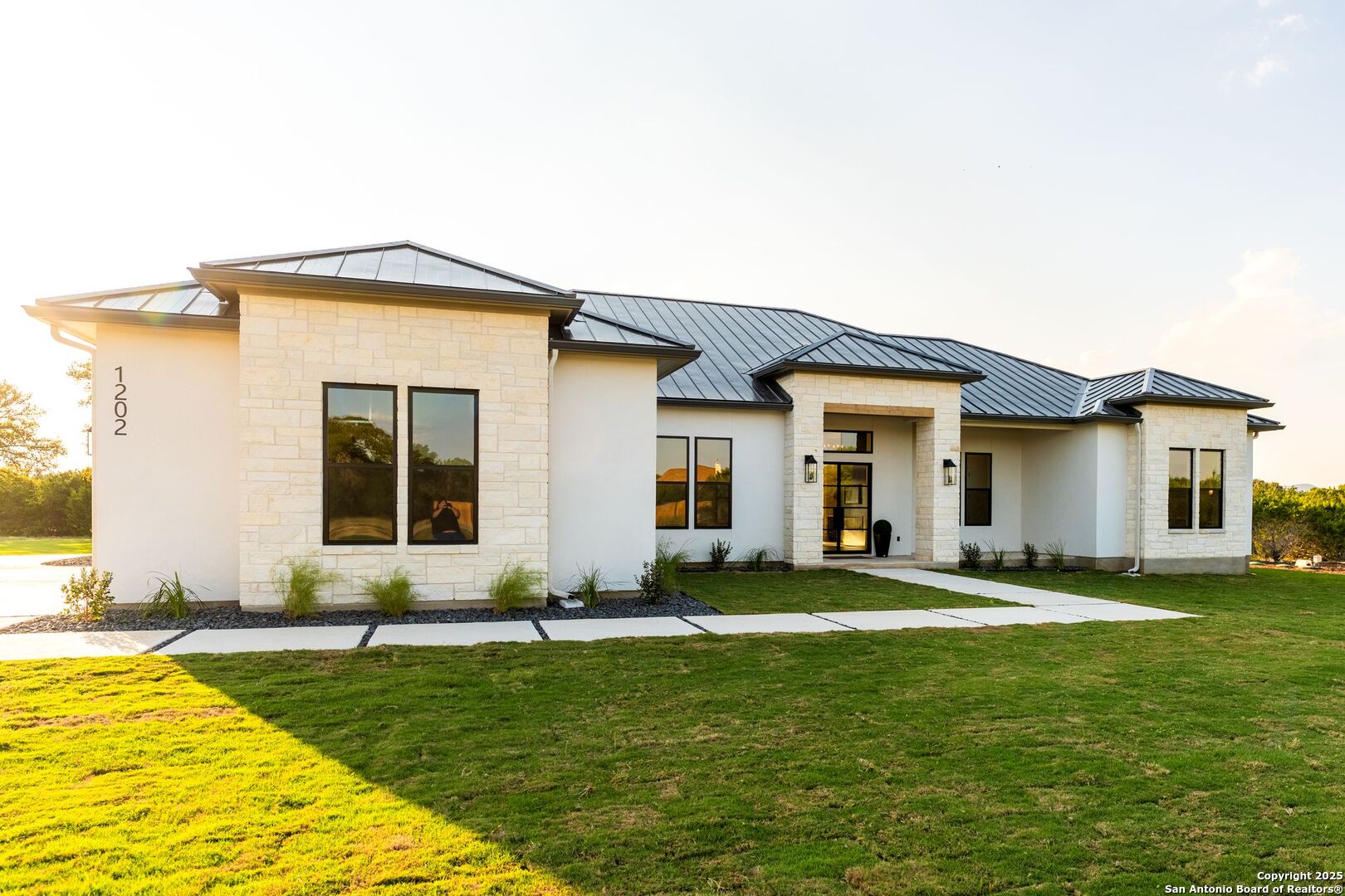 1202 Cielo Rio Drive Pipe Creek, TX 78063 - Photo 2 of 54 a front view of a house with a yard