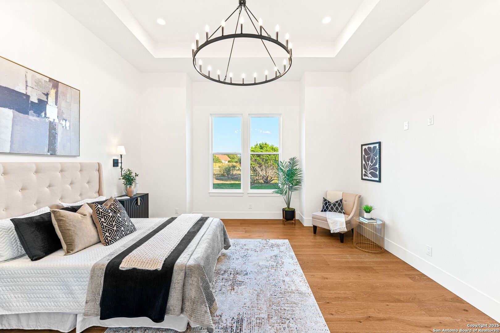 1202 Cielo Rio Drive Pipe Creek, TX 78063 - Photo 23 of 54 a bedroom with bed and a window