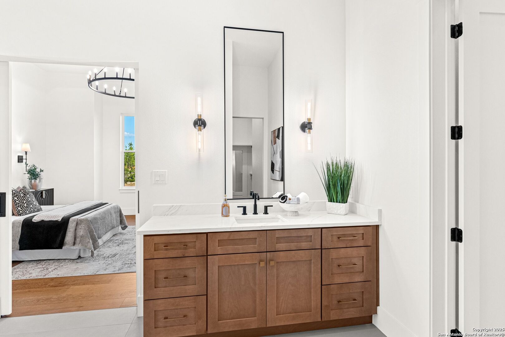 1202 Cielo Rio Drive Pipe Creek, TX 78063 - Photo 29 of 54 a bathroom with a sink and a mirror