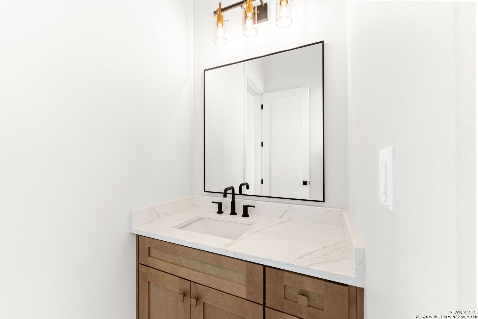 1202 Cielo Rio Drive Pipe Creek, TX 78063 - Photo 39 of 54 a bathroom with a sink and a mirror