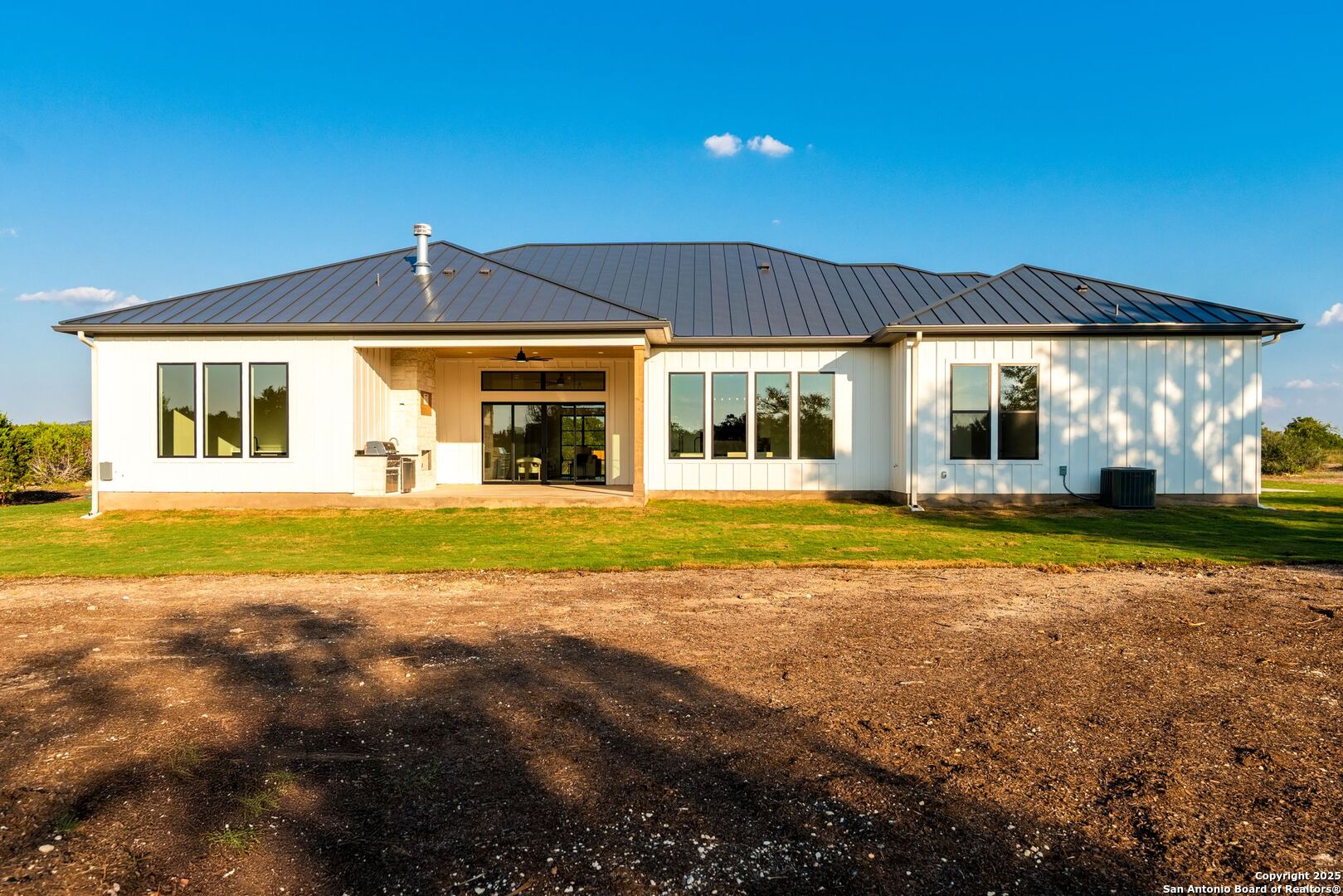 1202 Cielo Rio Drive Pipe Creek, TX 78063 - Photo 50 of 54 a view of a house with a swimming pool