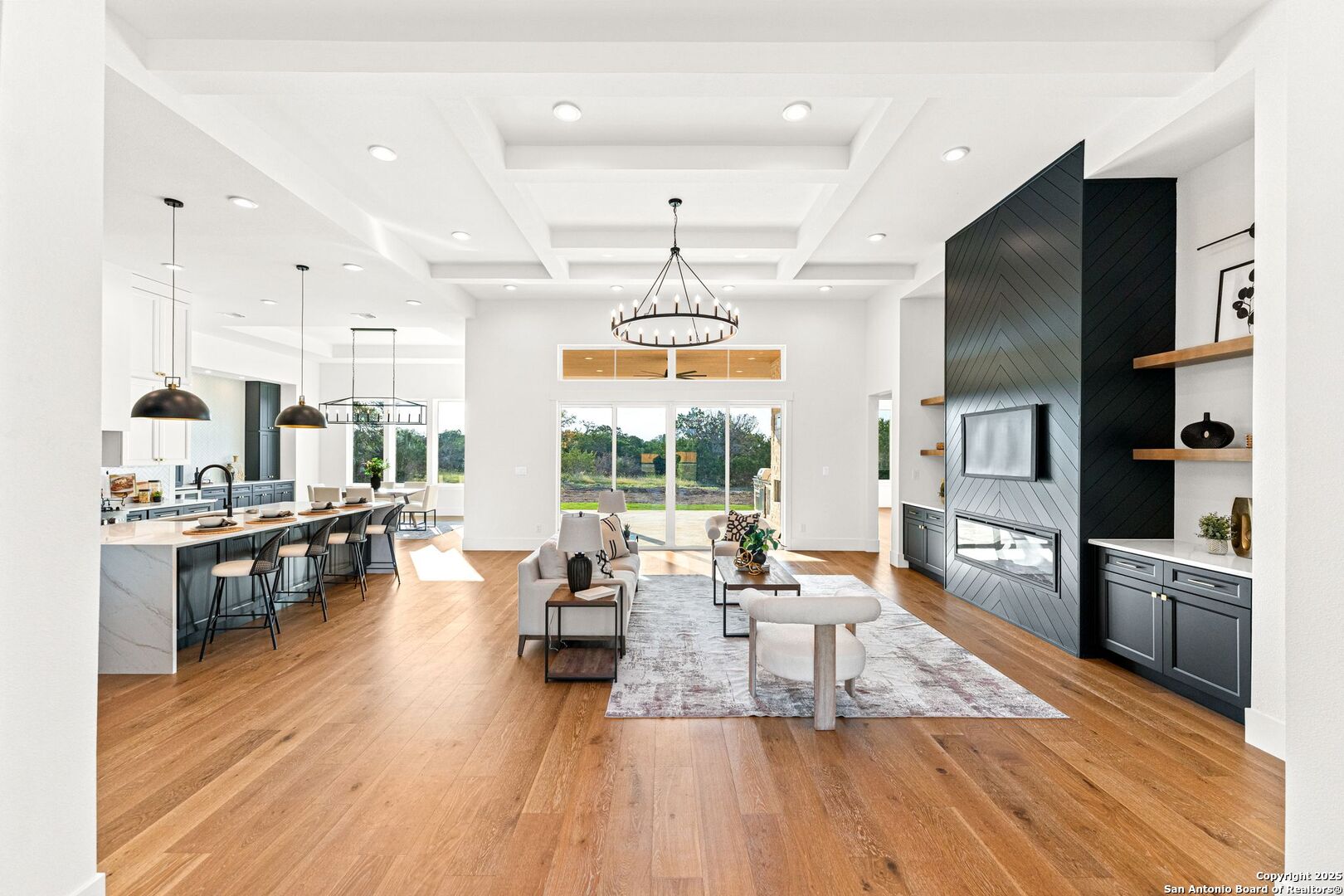 1202 Cielo Rio Drive Pipe Creek, TX 78063 - Photo 5 of 54 a living room with stainless steel appliances furniture wooden floor and a kitchen view