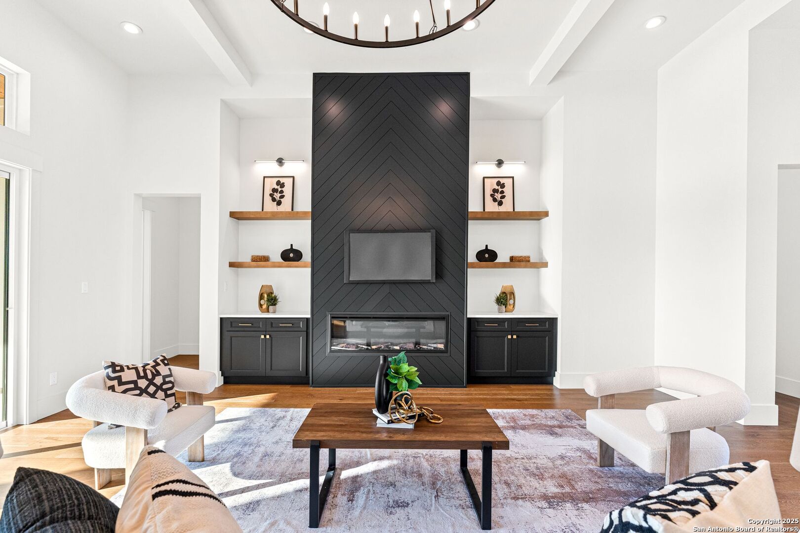 1202 Cielo Rio Drive Pipe Creek, TX 78063 - Photo 8 of 54 a living room with furniture a dining table and paintings on the wall