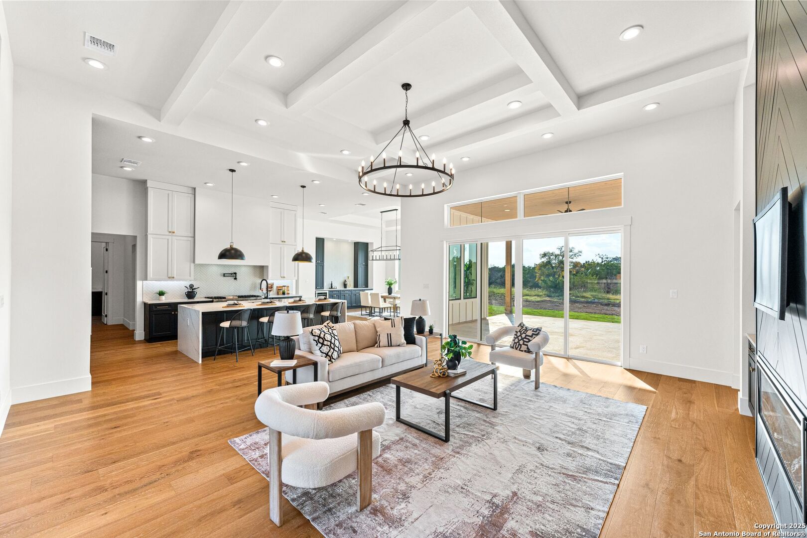 1202 Cielo Rio Drive Pipe Creek, TX 78063 - Photo 10 of 54 a living room with furniture and a dining table with wooden floor