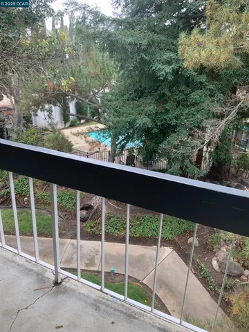 a view of a yard from a balcony