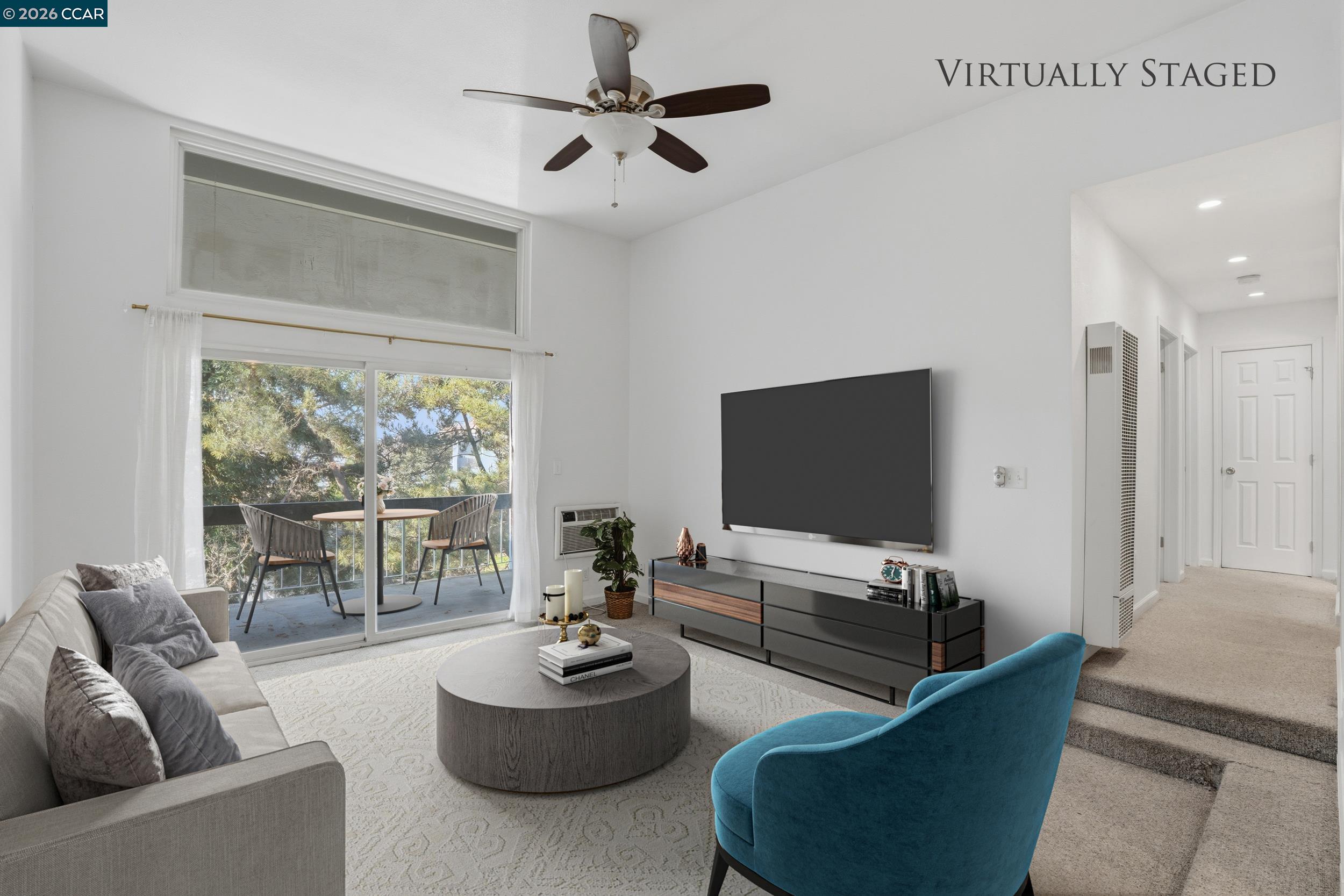 1591 Ellis Street, Unit 307 Concord, CA 94520 - Photo 3 of 13 a living room with furniture and a flat screen tv