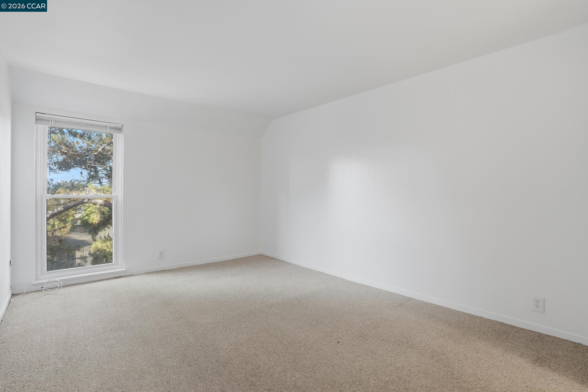 1591 Ellis Street, Unit 307 Concord, CA 94520 - Photo 10 of 13 a view of an empty room with a window