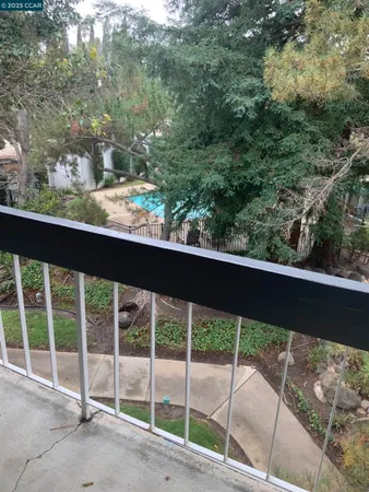 a view of a yard from a balcony