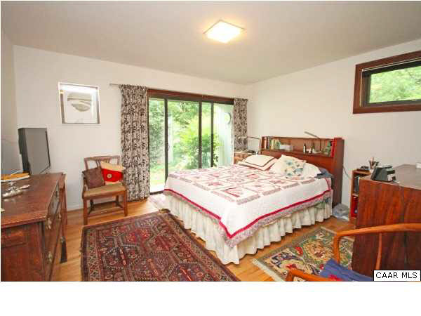 1620 Keith Valley Road Charlottesville, VA 22901 - Photo 11 of 24 a bedroom with a bed and a dresser next to a window