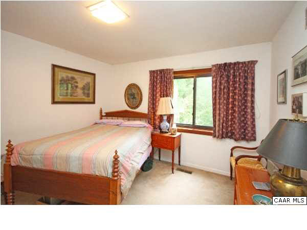 1620 Keith Valley Road Charlottesville, VA 22901 - Photo 13 of 24 a bedroom with a bed chair and a window