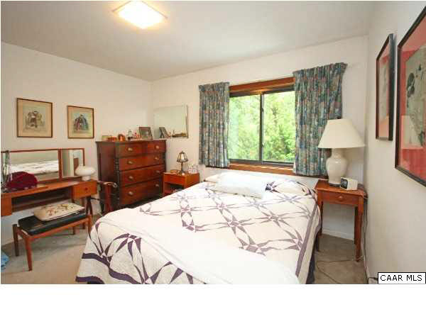 1620 Keith Valley Road Charlottesville, VA 22901 - Photo 14 of 24 a bed room with a bed and a chair