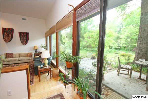 1620 Keith Valley Road Charlottesville, VA 22901 - Photo 10 of 24 a living room view with a flat screen tv and a floor to ceiling window