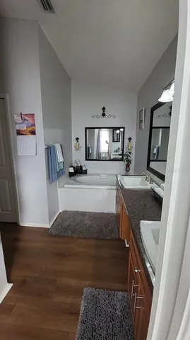 a kitchen with granite countertop a stove and a sink